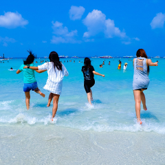  happy women enjoy in sea surf waves on beach pattaya in  thailand.