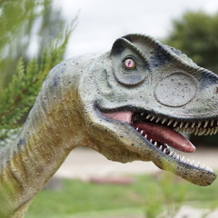 Dinosaur Statue in Green Garden