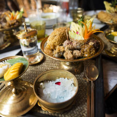 A set of Traditional Thai food Khao Chae on brass bowls and platters
