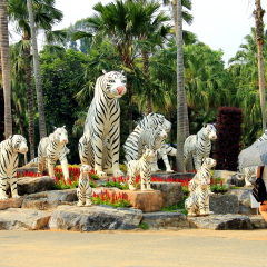 March 1, 2017, Pattaya, Thailand. Sculptures of white tigers in the landscape park Nong Nooch, Thailand.
