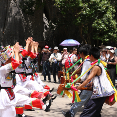 KUNMING, CHINA - 23 April 2009: Women and man performing a traditional marriage dance of the Yi minority in the Yunnan province of China.