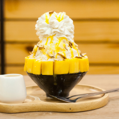 Mango Bingsu ( Korean Mango shaved ice )with Mango Sauce and almond Topping for Summertime