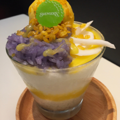 Bangkok ,Thailand,September 26 2018 Mango ice cream and sticky rice bingsu in glass on table in swensen's restaurant