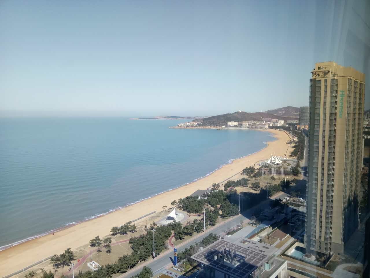 威海国际海水浴场海景壹号躺在床上看海景普通公寓