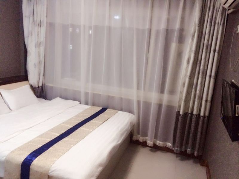 瓦房店名仕宾馆