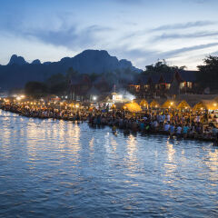 Tourists relax along Xong river in Vangvieng, Vientiane, Laos.