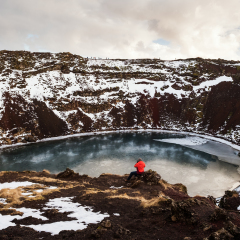 Traveler enjoying beautiful view at Kerio Crater with Lake in Iceland