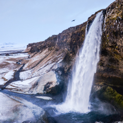 Seljalandsfoss waterfall in Iceland with winter panoramatic scenery