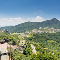 Modern castles on the top of mountain against cloudy sky in Overseas Chinese Town East  (OCT East ) in Shenzhen, Guangdong, China.