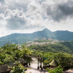 Modern castles on the top of mountain against cloudy sky in Overseas Chinese Town East  (OCT East ) in Shenzhen, Guangdong, China.