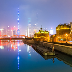 beautiful reflection in suzhou creek,misty shanghai skyline at night