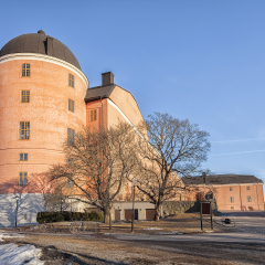 Image of a bridge and old buildings by the river in the center of Uppsala, Sweden. 