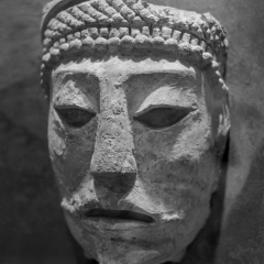 Closeup of the stone head mask originating from Comalcalco, Tabasco, Mexico, Mayan Civilization