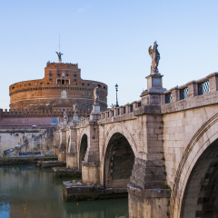 Castle of Holy Angel (Castel Sant Angelo)  and Holy Angel Bridge over the Tiber River in Rome at sunset. Italy, Europe 