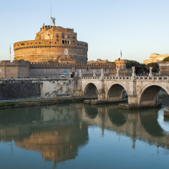 Castle of Holy Angel (Castel Sant Angelo)  and Holy Angel Bridge over the Tiber River in Rome at sunset. Italy, Europe 