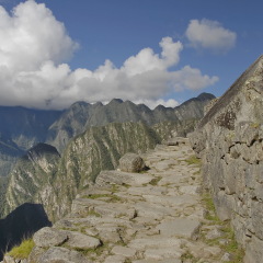 Stone trail in ancient Inca citadel Machu Picchu, Peru.