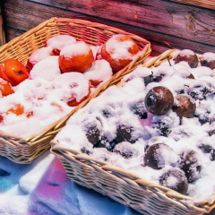 The frozen persimmons and pears, which are eaten in winter by the locals, shot in the Snow Village in Hei'longjiang Province, northeast of China.