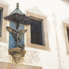 Detail of St. George's statue fighting a Dragon placed on facade of Charity House (Casa de la Caridad), located in Raval near Barcelona University, MACBA and CCCB in Barcelona, Spain.