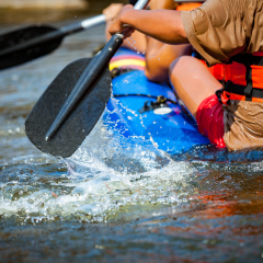 Focus some part of young person are rafting in river.