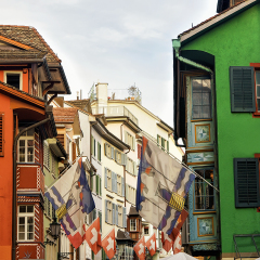 Flags on Augustinergasse pedestrian Street in Zurich center, Switzerland