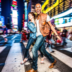Mixed race couple walking around in New York City, pedestrian crossing