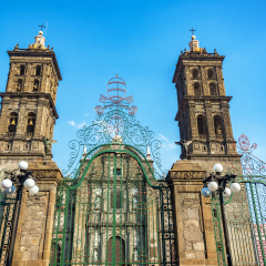 Green gate outside the cathedral in the historic center of Puebla, Mexico