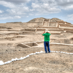 CAHUACHI, NAZCA, ICA, PERU: Mature man take pictures in the ruis of Cahuachi, Nazca.