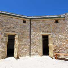 An old courtyard with doors.