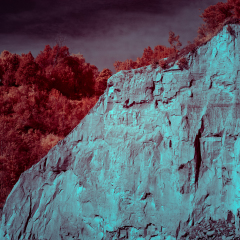 Cliff with trees in autumn in Canada. Moody stormy beautiful landscape.