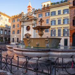 two fountains from old bathtub in square if front of embassy of France. Rome. Italy.