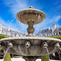 Fountain on the Place des Vosges (Place Royale)  - the oldest square in Paris located in Le Marais district.