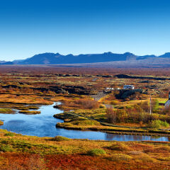 Thingvallakirkja church along banks of Oxara River in Thingvellir National Park, Iceland, autumn afternoon