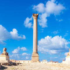 Pompey's pillar and ancient sphinx statue roman triumphal column in Alexandria, Egypt