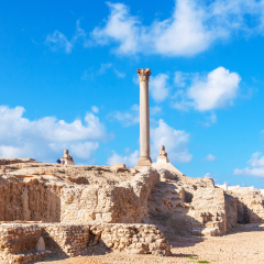Pompey's pillar and ancient sphinx statue roman triumphal column in Alexandria, Egypt