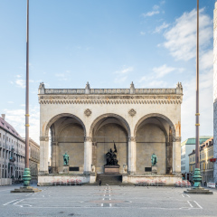 Field Marshall's Hall, Feldherrnhalle, located on Odeonsplatz, built to honor Bavaria's heroes under morning cloudy sky with unrecognized people in Munich, Germany
