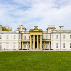front view of majestic dundurn castle in city of hamilton in ontario canada blue sky clouds park area green grass