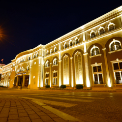 Beautiful view of Museum of the Macedonian Struggle building at night in Skopje, Macedonia.
