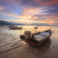 Beautiful Sunset Scenery of fisherman village at Black Sand Beach Village in Langkawi, Malaysia. 