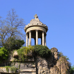 Parc des Buttes Chaumont in Paris, France. The most famous feature of the park is the Temple de la Sibylle, inspired by the Temple of Vesta in Tivoli.