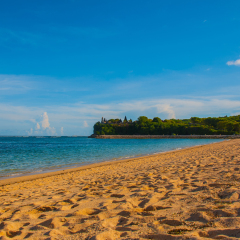 Beautiful beach and temple in Nusa Dua Bali. Geger Beach. Indonesia.