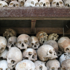 Human skulls fill memorial stupa at the killing fields of Choeung Ek outside Phnom Penh, Cambodia