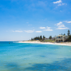 Cottesloe Beach and the Indiana Tea House on a summer day with a clear blue sky. Cottesloe Beach is a popular location for tourists to visit in Perth, Western Australia, Australia.