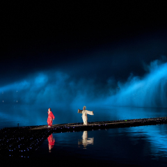 HANGZHOU, CHINA - NOVEMBER 26: Artists perform in Zhang Yimou's outdoor folk musical show 'Impressions West Lake' in an outdoor theatre built in the lake on November 26, 2011 in Hangzhou, China.