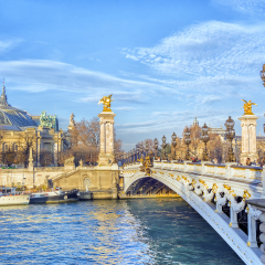 View of Alexandre III Bridge and Grand Palais (Grand Palace) across the Seine River, Paris, France.