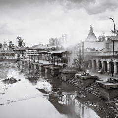 KATHMANDU - APRIL 15: Cremation ceremony along the holy Bagmati River at Pashupatinath Temple complex, April 15, 2012 in Kathmandu, Nepal. This is the most sacred place to all Hindus in Nepal.