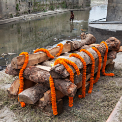 Cremation ceremony along the holy Bagmati River at Pashupatinath Temple complex