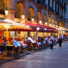 Street restaurants at Placa Reial in summer night. Barcelona, Spain