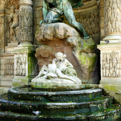 Color DSLR stock image of the Medicis Fountain in Luxembourg Gardens, Paris, France, erected in 1861. The Left Bank, Latin Quarter landmark is popular with tourists and locals. Vertical. 