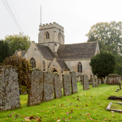 Church of Minster Lovell in Cotswold village with graveyard