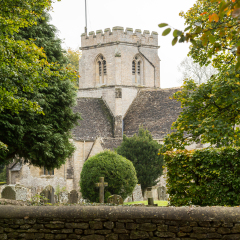 Church of Minster Lovell in Cotswold village with graveyard
